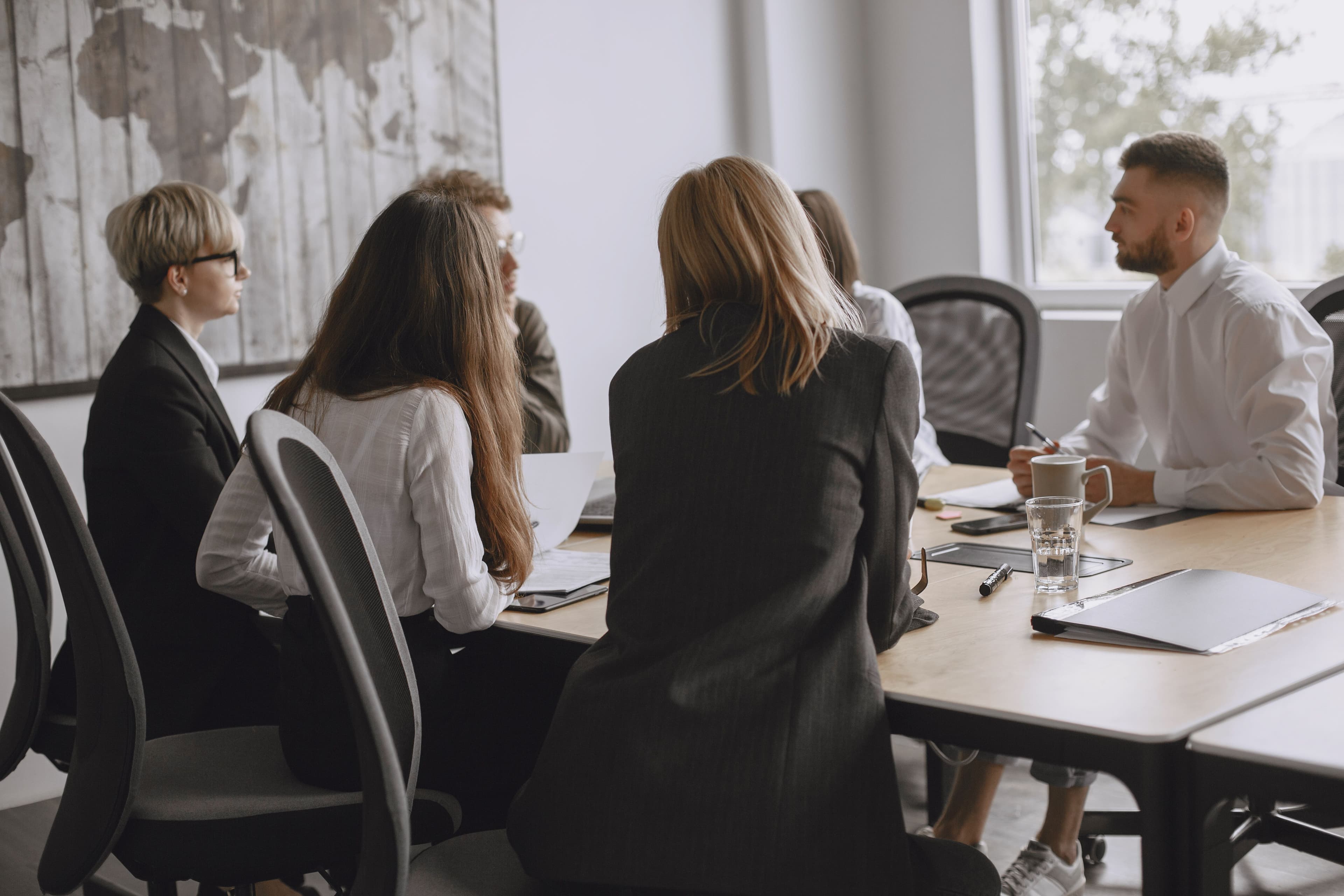 A diverse, modern global team collaborating in a bright corporate office